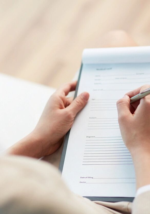 closeup shot of a woman filling a form